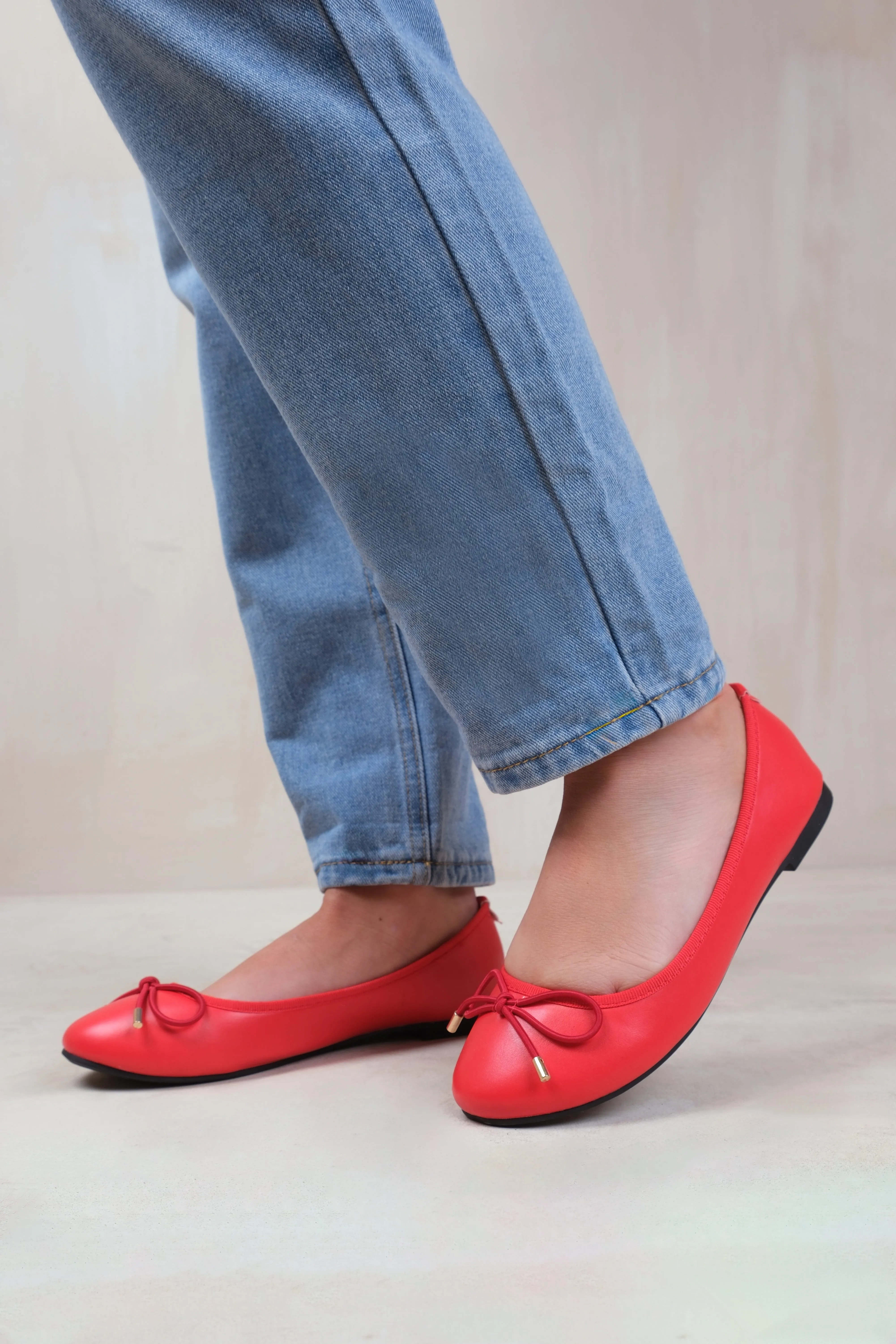 BEXLEY SLIP ON FLAT PUMPS IN RED FAUX LEATHER